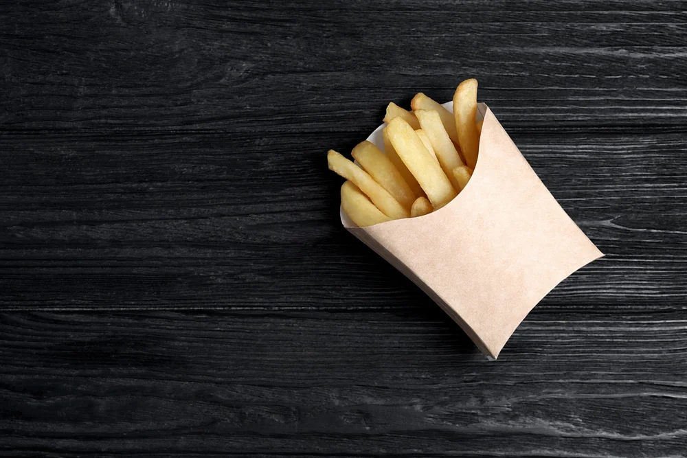 delicious French fries in paper box